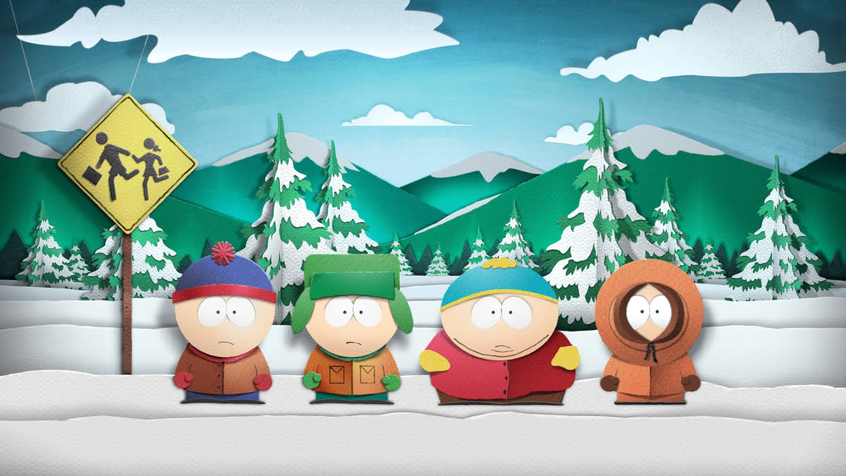 Vier Cartoon-Figuren stehen in einer Schneelandschaft.