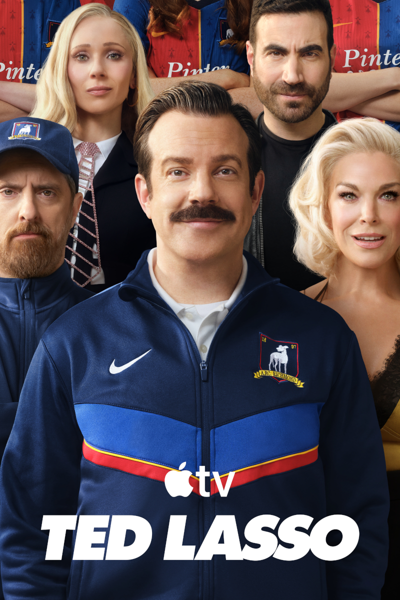 **Alt-Text:** Poster der Apple-TV-Serie «Ted Lasso»: Sechs Personen posieren gemeinsam, im Vordergrund ein Mann mit Schnurrbart in einer blauen Nike-Trainingsjacke mit dem AFC-Richmond-Logo.